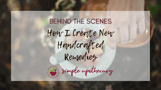 Text: Behind the scenes. How I create new handcrafted remedies. Image: A hand is pouring essential oils into a mortar filled with herbs and a pestle. Logo of Simple Apothecary.